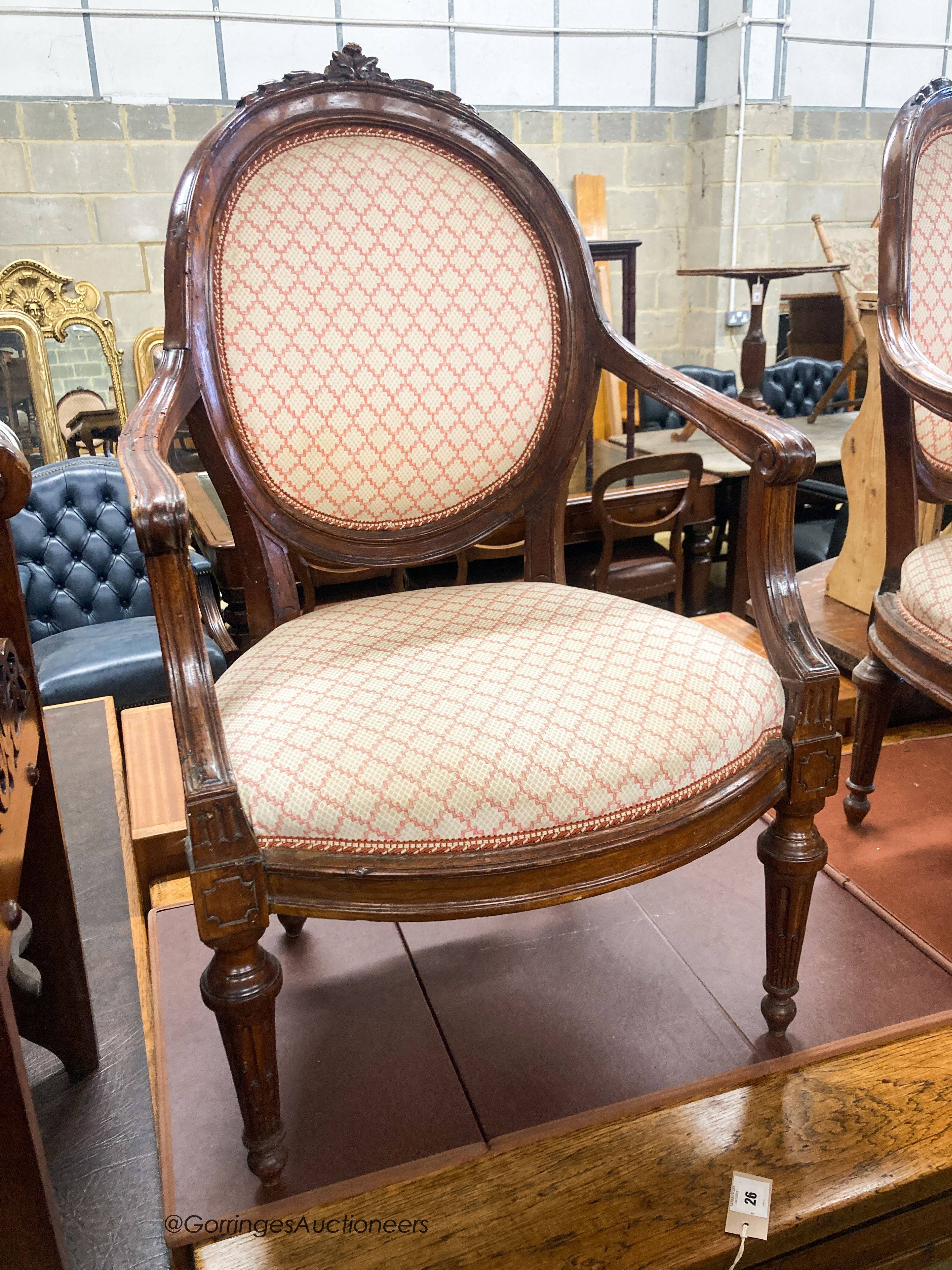 A pair of 19th century French walnut upholstered elbow chairs, W.62cm D.50cm H.102cm